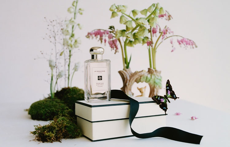 stack of jo malone london cream and black boxes deluxe samples. 9ml colognes, 15ml Body Washes & Body cremes.